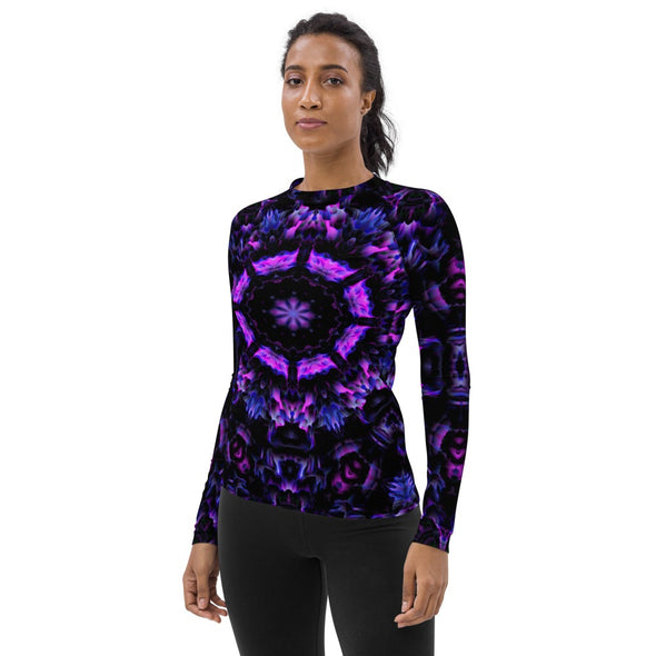 Photograph of a model wearing Bleace unisex MetaParty Vibes Kaleidoscopic purple, blue, and pink, Trippy Visual rash guard.  