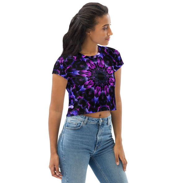 Product Photograph of a unisex Bleace MetaParty Vibes Kaleidoscopic purple, blue, and pink, Trippy Visual crop top tee shirt in the foreground with a white background.