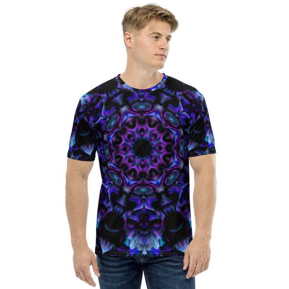 Photograph of a model wearing a unisex Bleace MetaParty Vibes Kaleidoscopic purple, blue, and pink, Trippy Visual tee shirt in the foreground with a white background.  