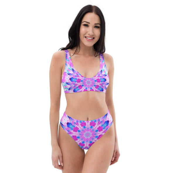 Product Photograph of a Bleace MetaParty Vibes Kaleidoscopic blue, pink and white Trippy Visual Recycled High-Waisted Bikini in the foreground with a white background.