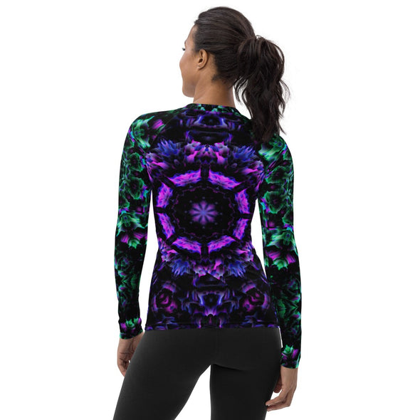 Product Photograph of a unisex Bleace MetaParty Vibes Kaleidoscopic purple, blue, pink, and green Trippy Visual rash guard in the foreground with a white background.