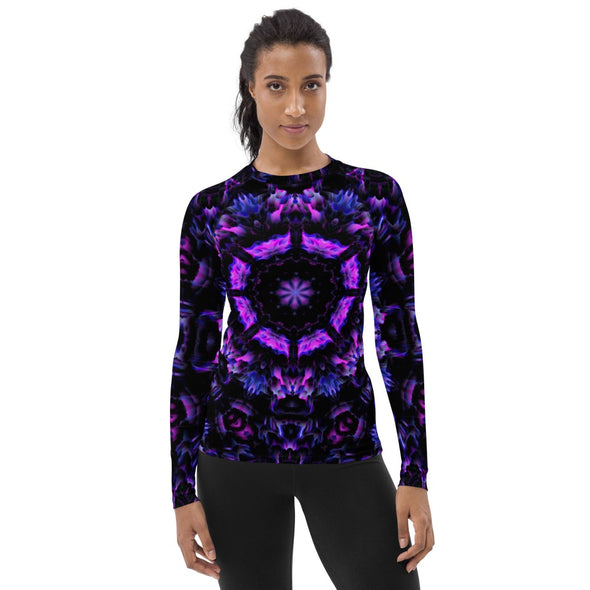 Photograph of a model wearing Bleace unisex MetaParty Vibes Kaleidoscopic purple, blue, and pink, Trippy Visual rash guard.  