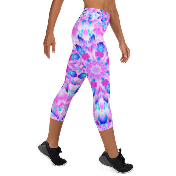 Product Photograph of a unisex Bleace MetaParty Vibes Kaleidoscopic blue, pink and white Trippy Visual yoga capri leggings in the foreground with a white background.