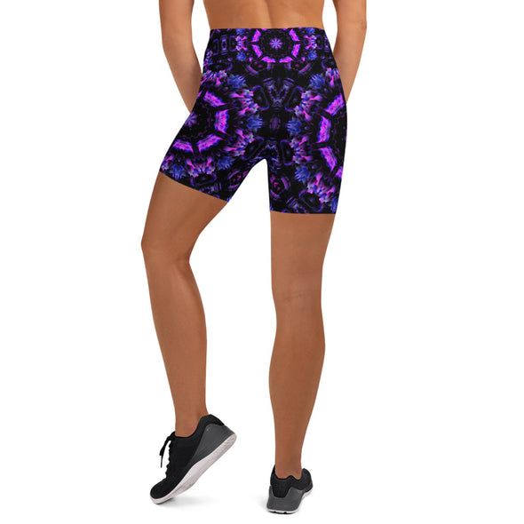 Photograph of a model wearing Bleace unisex MetaParty Vibes Kaleidoscopic purple, blue, and pink, Trippy Visual yoga shorts.  