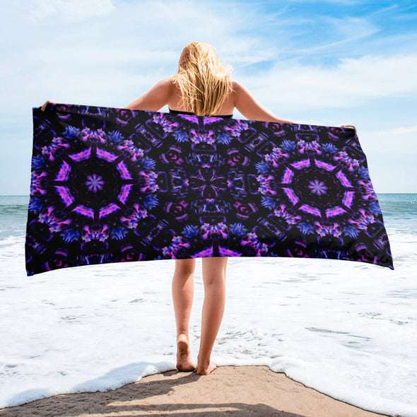 Photograph of a model wearing Bleace unisex MetaParty Vibes Kaleidoscopic purple, blue, and pink, Trippy Visual towel in the foreground with a white background.  